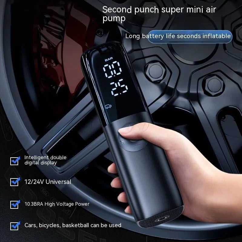 Black portable electric car air pump with plug-in connection and pressure gauge
