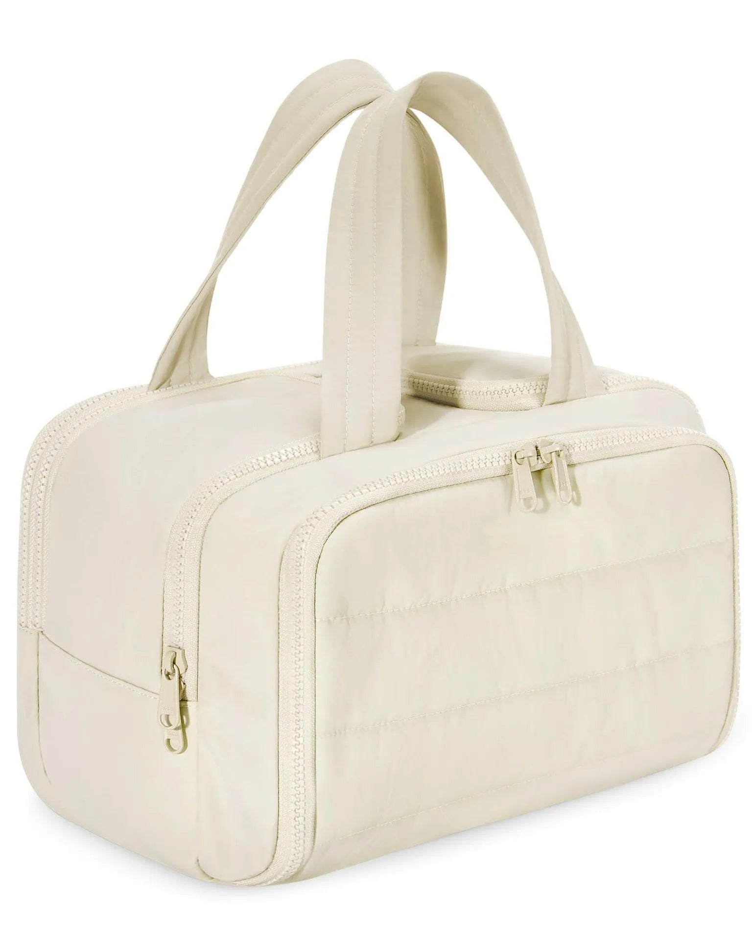 Large fluffy travel toiletry bag in beige colour with wide open design showing interior