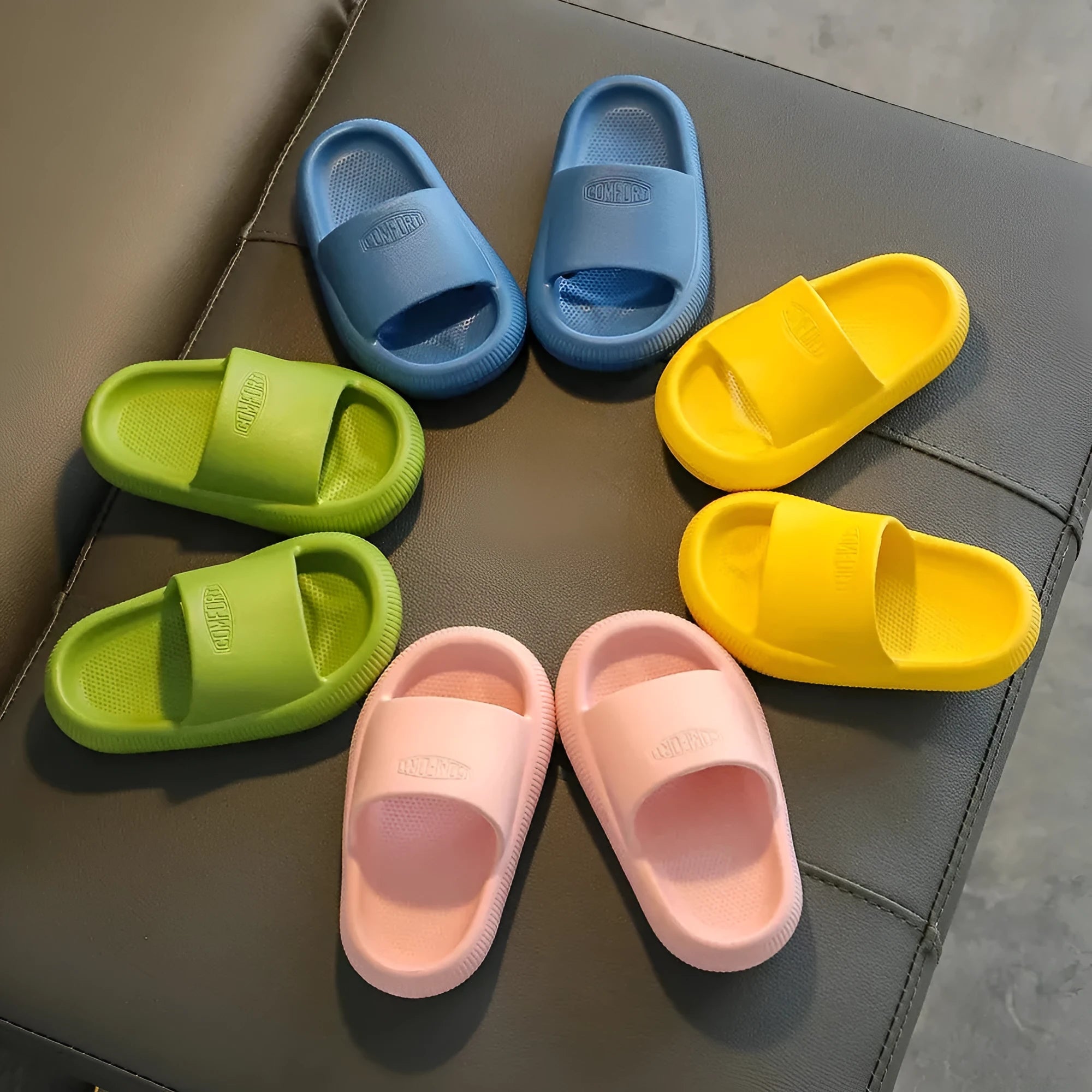 Children's EVA slippers with non-slip soles in mixed colour options showing size range
