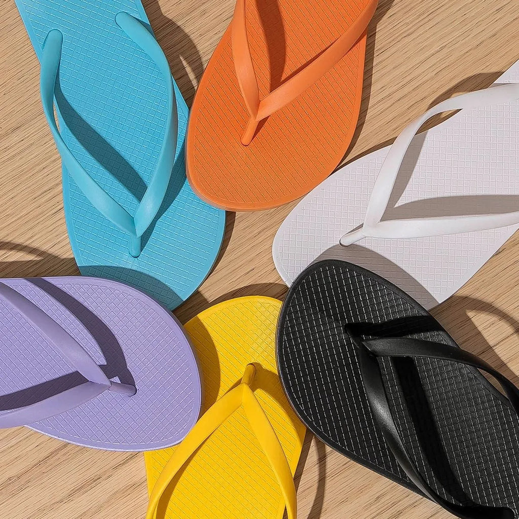 Foldable casual slippers with a hollow-out plastic upper and non-slip PVC sole in black colour.