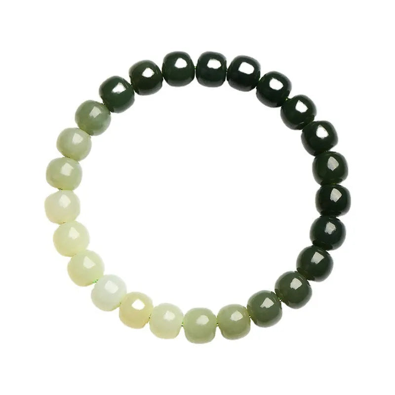 Polished Hetian jade bracelet with gradient clear water colour on wrist.