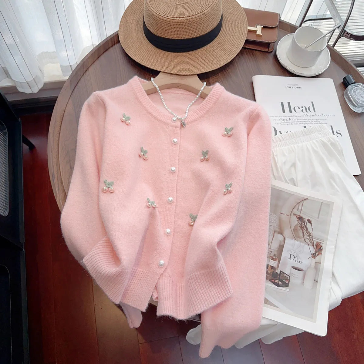 Women's beaded cardigan sweater in free size available in four colours with round neck design