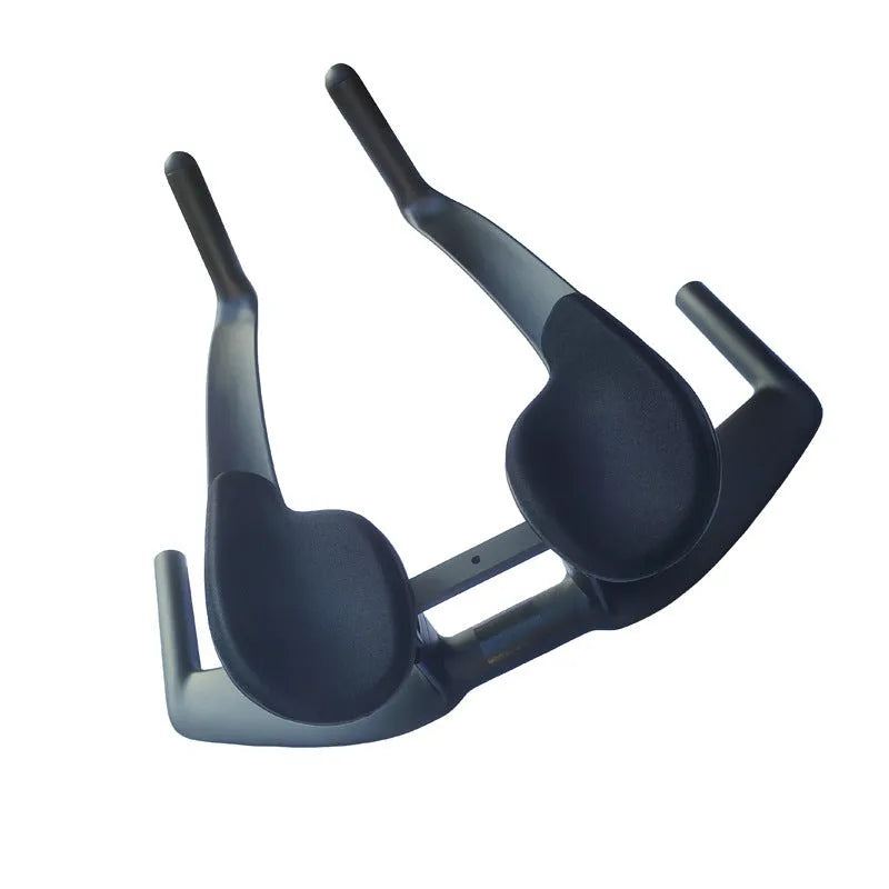 Black carbon fibre TT bicycle handlebars showing angled extensions and clamp area.