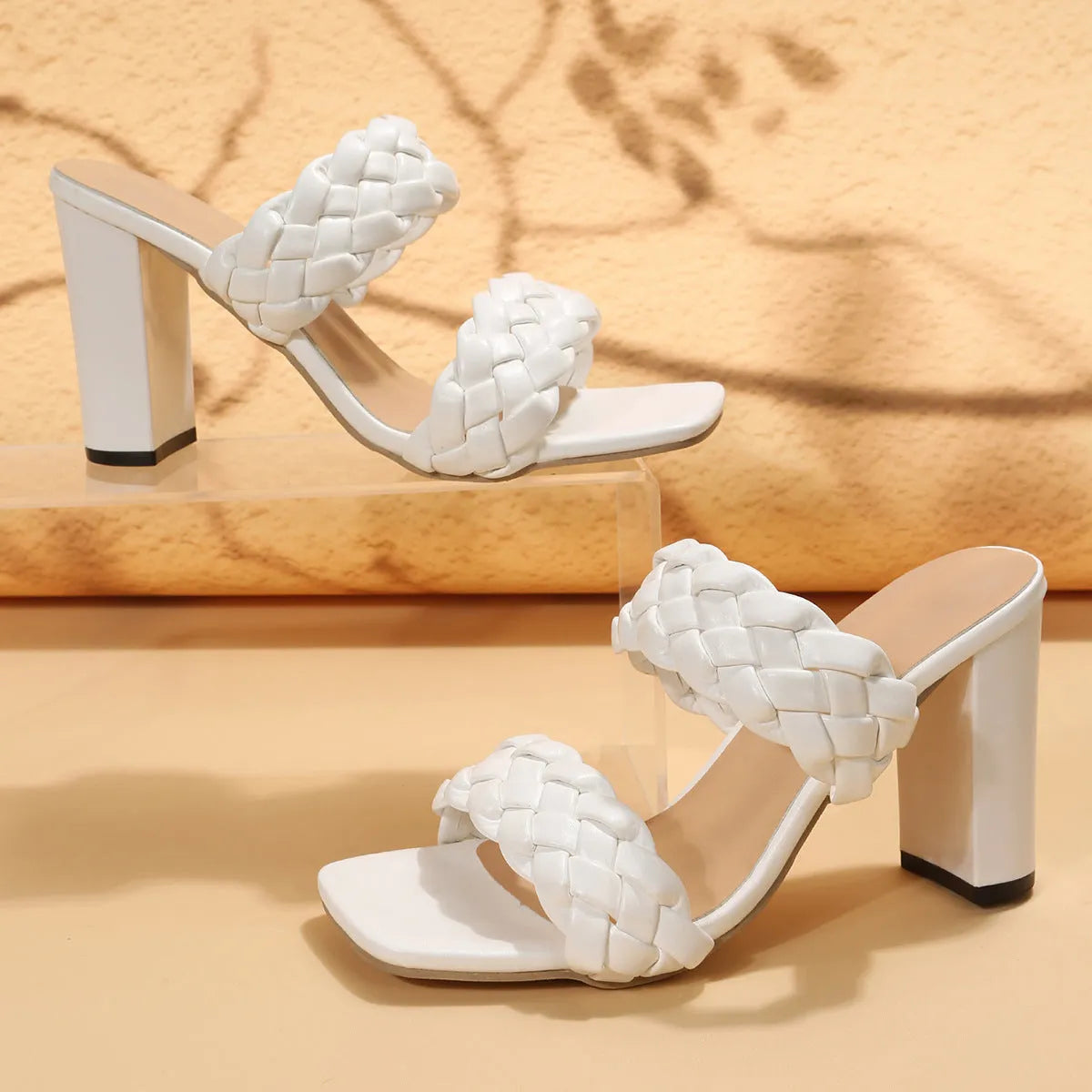 Square toe flip-flops with chunky heel and woven twisted straps in white colour