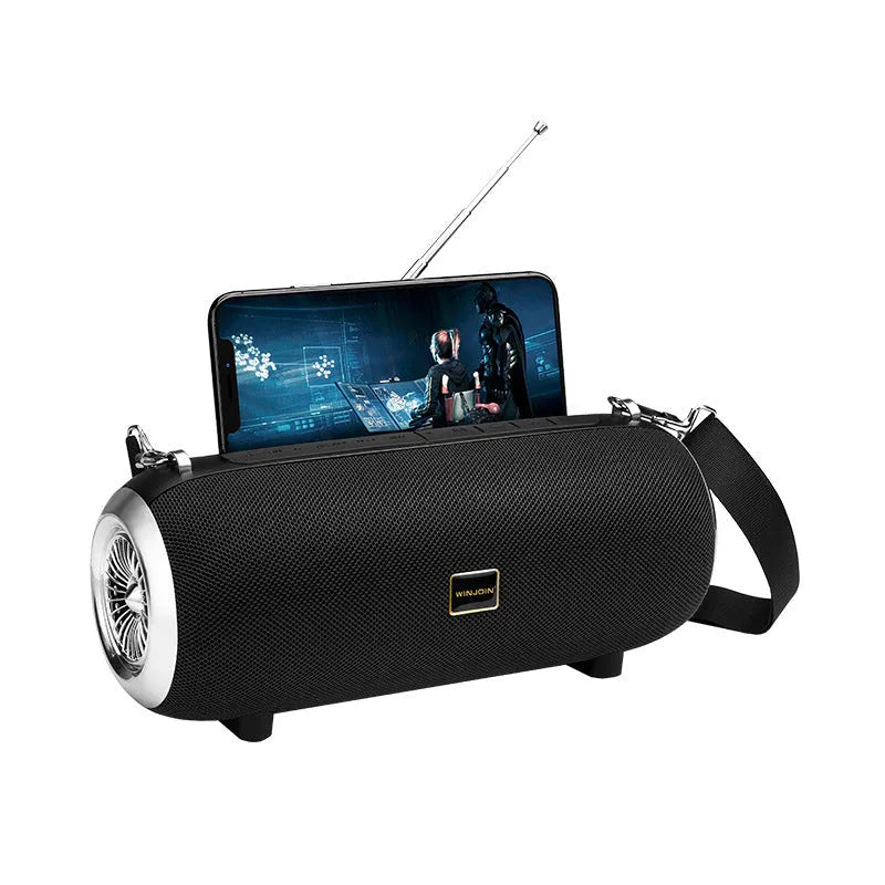 F666 portable Bluetooth speaker in mesh plastic case with shoulder strap, shown next to a mobile phone.
