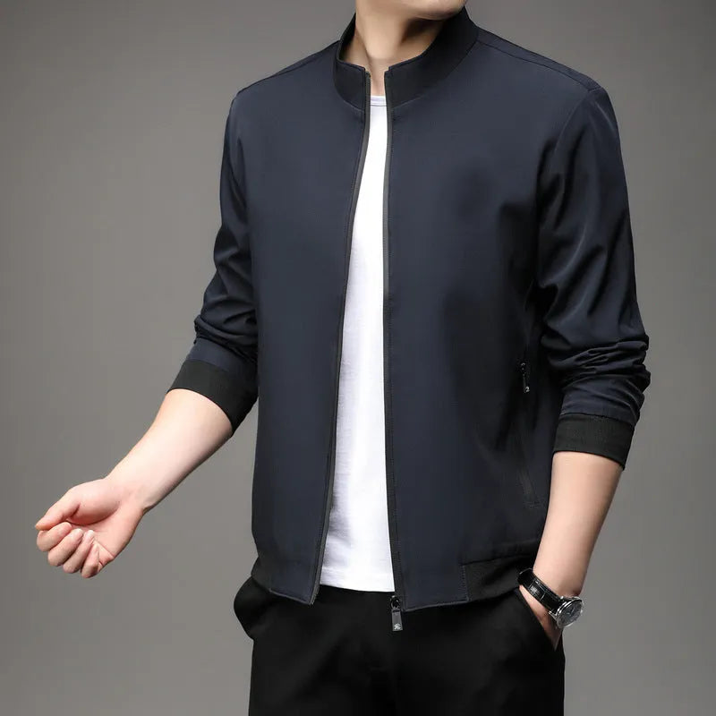 Korean style loose fit casual jacket in black with zip and patch pockets on a man.