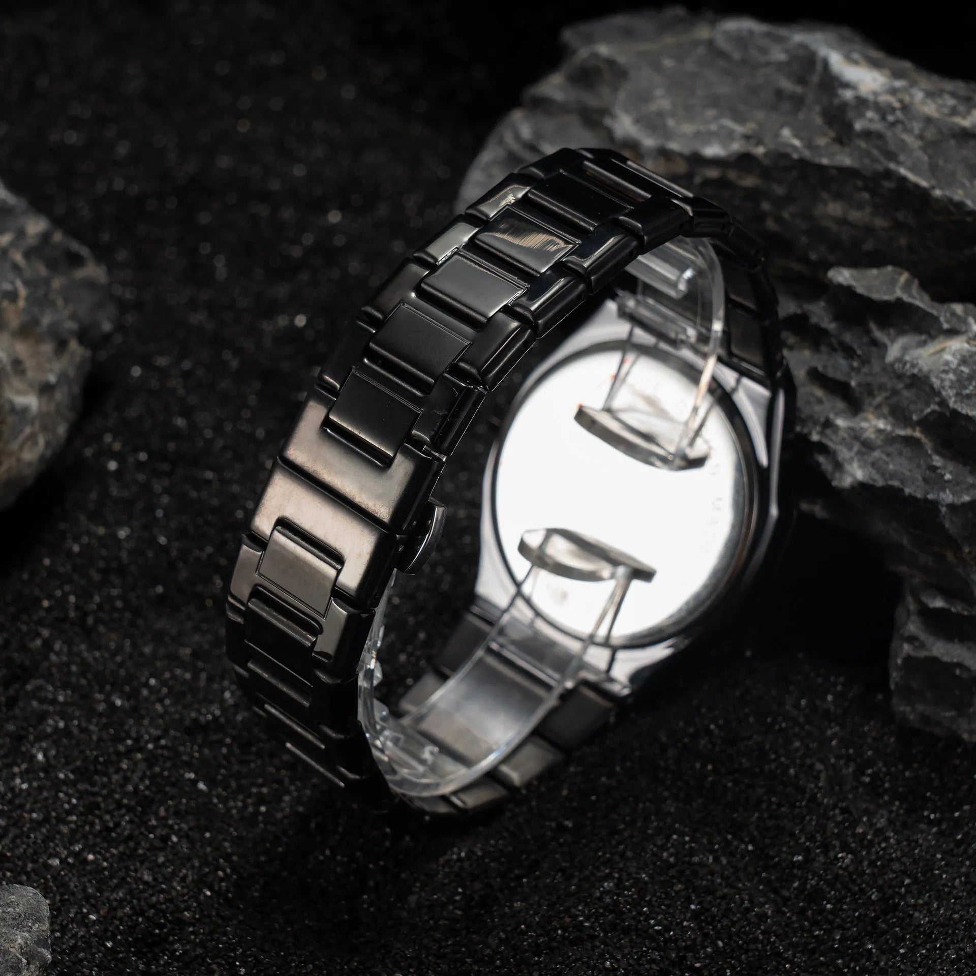 Men's steel bracelet quartz watch in business style on a wrist.