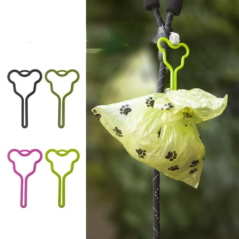 Hands-free dog poo bag holder with velcro strap attached to a dog lead.