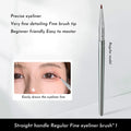Close-up of a bent head eyeliner brush for precise under eye and tear trough makeup application.