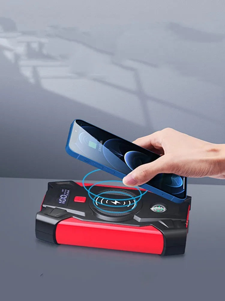 Red car emergency jump starter power pack with crocodile clips and digital display screen