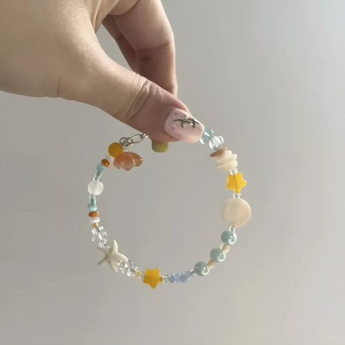 Orange sea colour alloy bracelet with diamond-shaped charms and round decorative elements for women