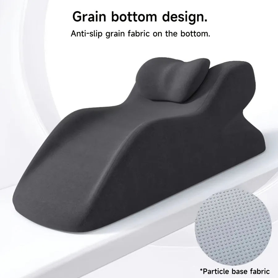 Ergonomic stomach sleeper pillow for reading in bed, shown in blue colour