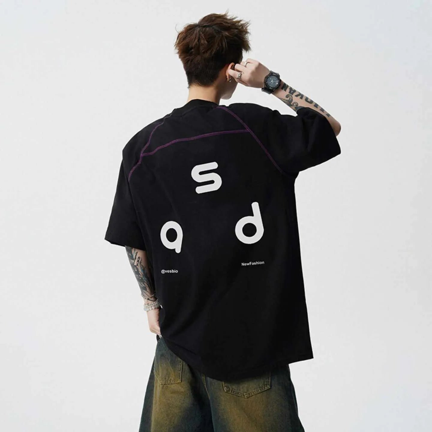 Men's loose fit cotton T-shirt with letter print design in black colour showing short sleeves and round neck