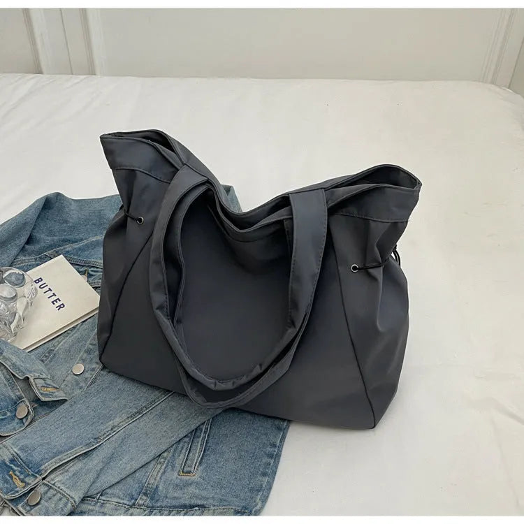 Soft Oxford cloth folding shoulder tote bag shown in available colour options