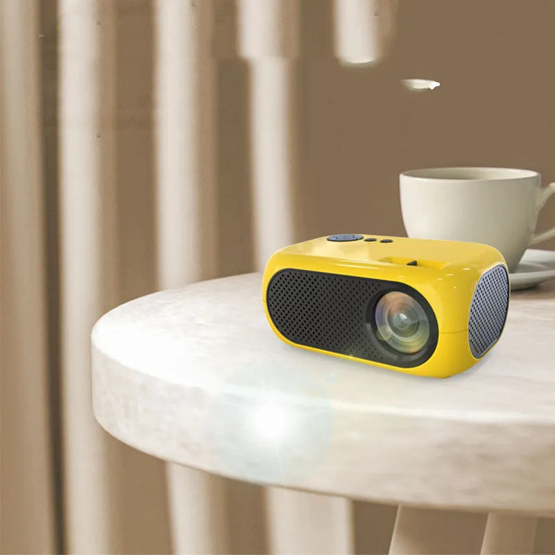 M24 micro mini projector in gold or white colour with power adapter and AV cable