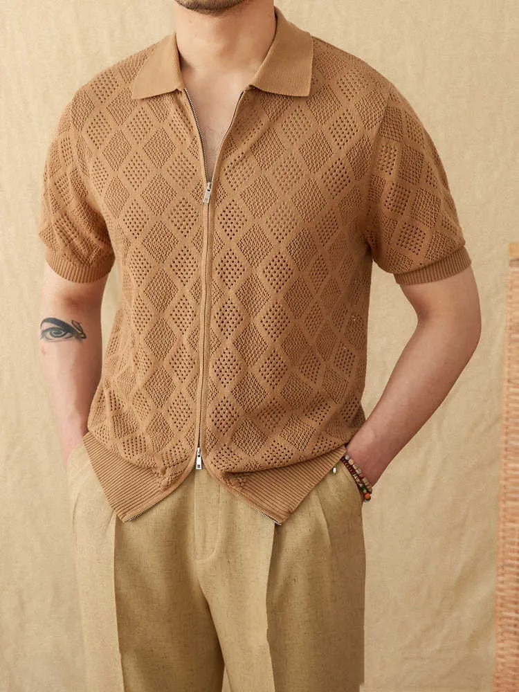 Light brown cotton short sleeve cardigan with lapel collar and front zipper closure on hanger