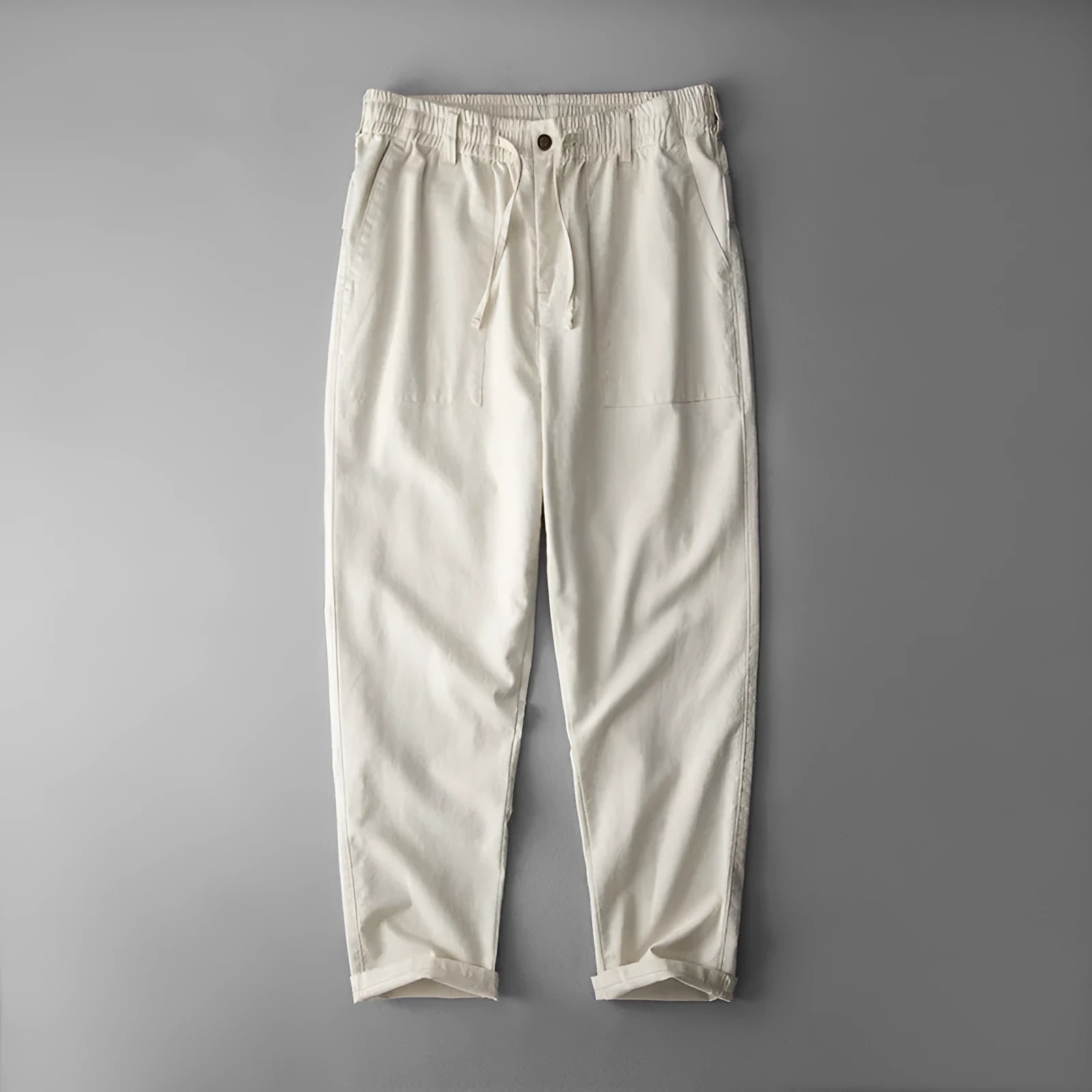 Men's mid waist linen trousers in solid colours showing trousers length and casual styling