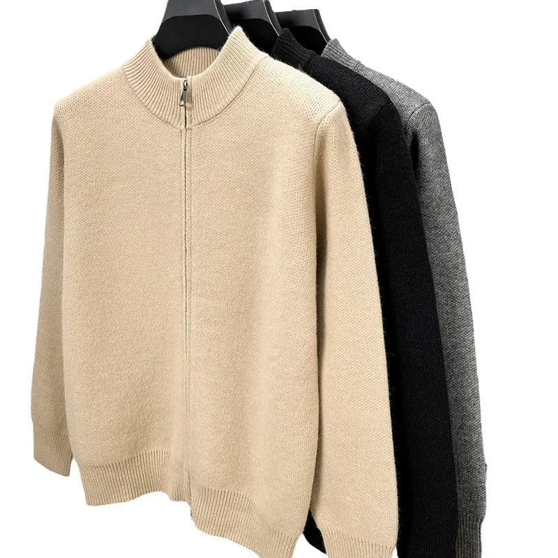 Man wearing a beige high collar zip-front knit cardigan, loose fit, long sleeves.