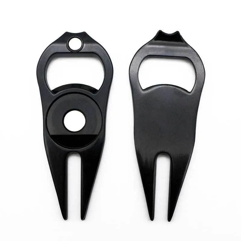 Zinc alloy golf ball yoke and bottle opener tool in black or green on a putting green.