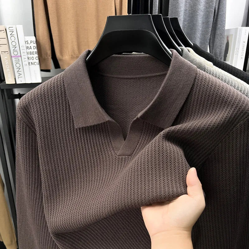 Men's loose fit plain pullover sweater in green, shown on a model for scale.
