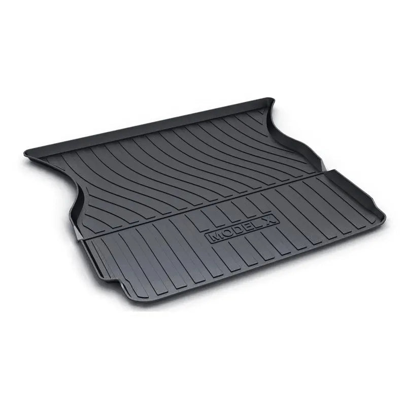 Custom rubber floor mats for Tesla cars with a textured TPE driver footrest section.
