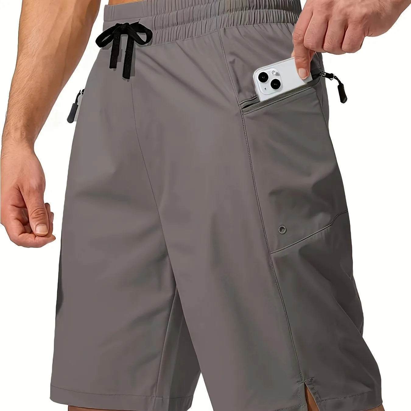 Man wearing straight cut quick-dry polyester beach shorts in a solid colour.