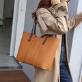 Women's genuine leather crossbody commuter bag in horizontal square shape with multiple internal compartments