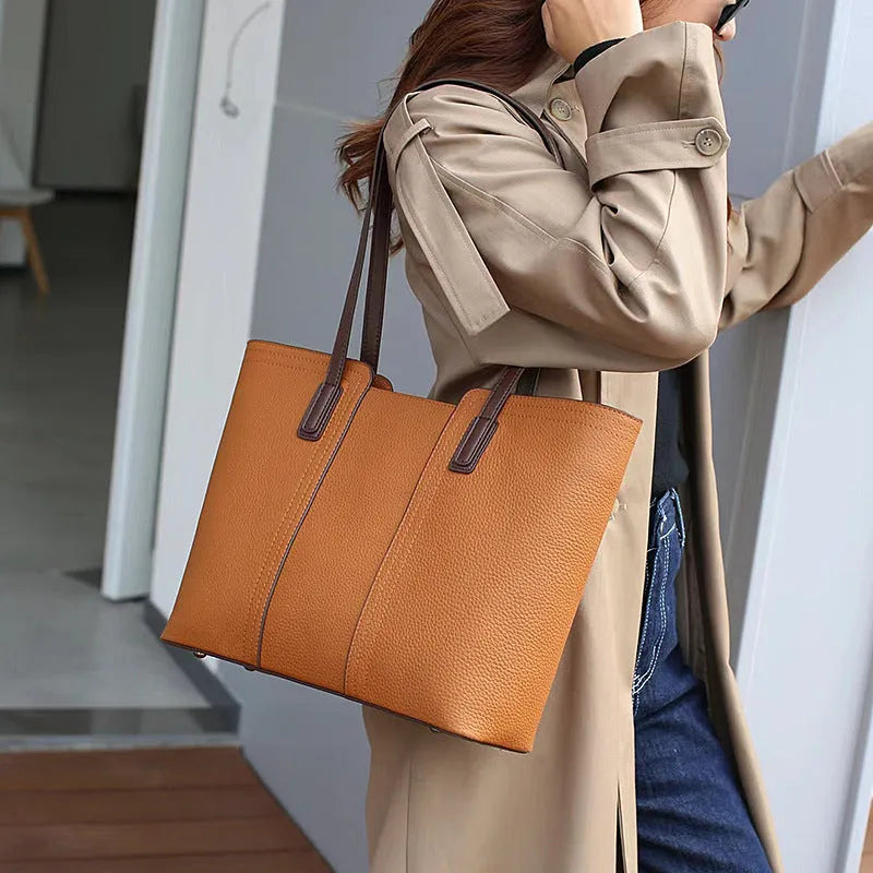 Women's genuine leather crossbody commuter bag in horizontal square shape with multiple internal compartments