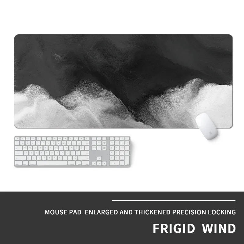 Oversized thick gaming mouse pad with printed e-sports design on a desk with keyboard and mouse.