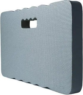 Blue garden kneeler pad with thick foam cushioning on soil next to plants