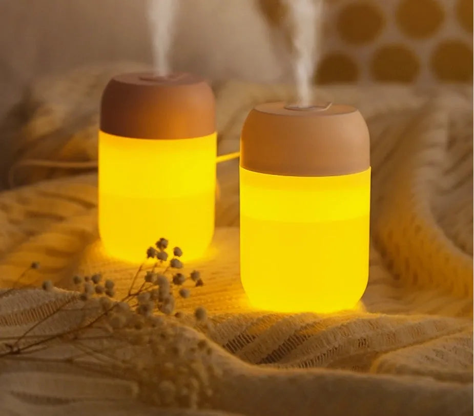White cylindrical mini humidifier with USB cable for small room aromatherapy and humidification