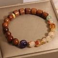 Women's yellow tower crystal and ebony amethyst bracelet with pearl and rhinestone decoration