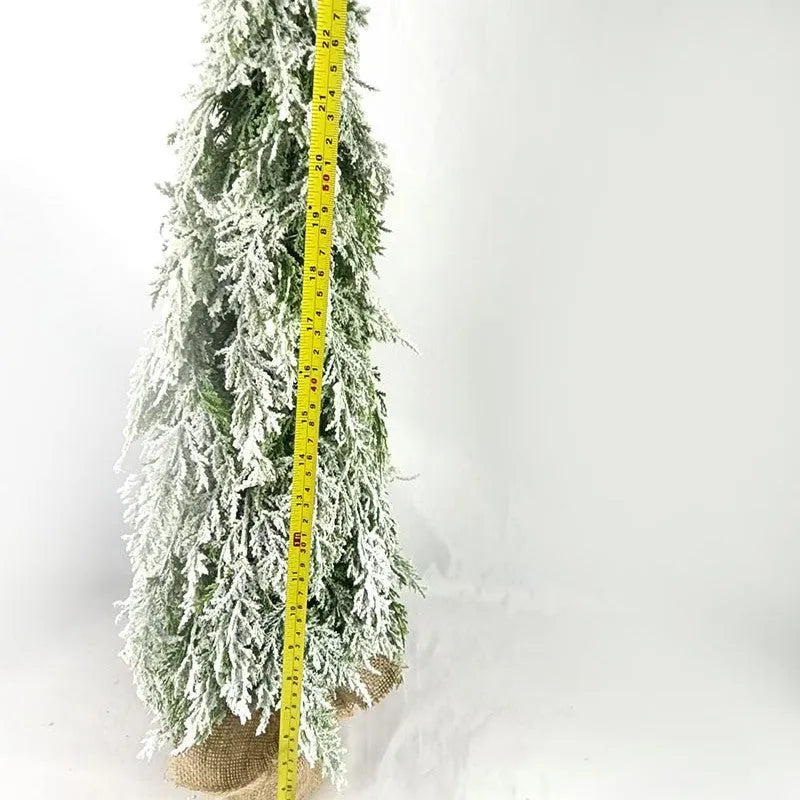 24-inch plastic Christmas tree with PE simulation snow spray effect and built-in lights on desktop