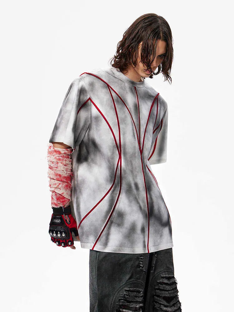 Women's short sleeve t-shirt with padded shoulders and raised line patchwork design on a round neck.