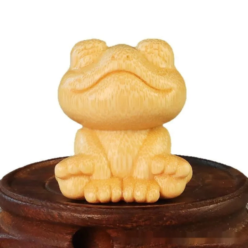 Smiling frog bamboo carving ornament measuring 5cm height with cartoon cute style decorative design
