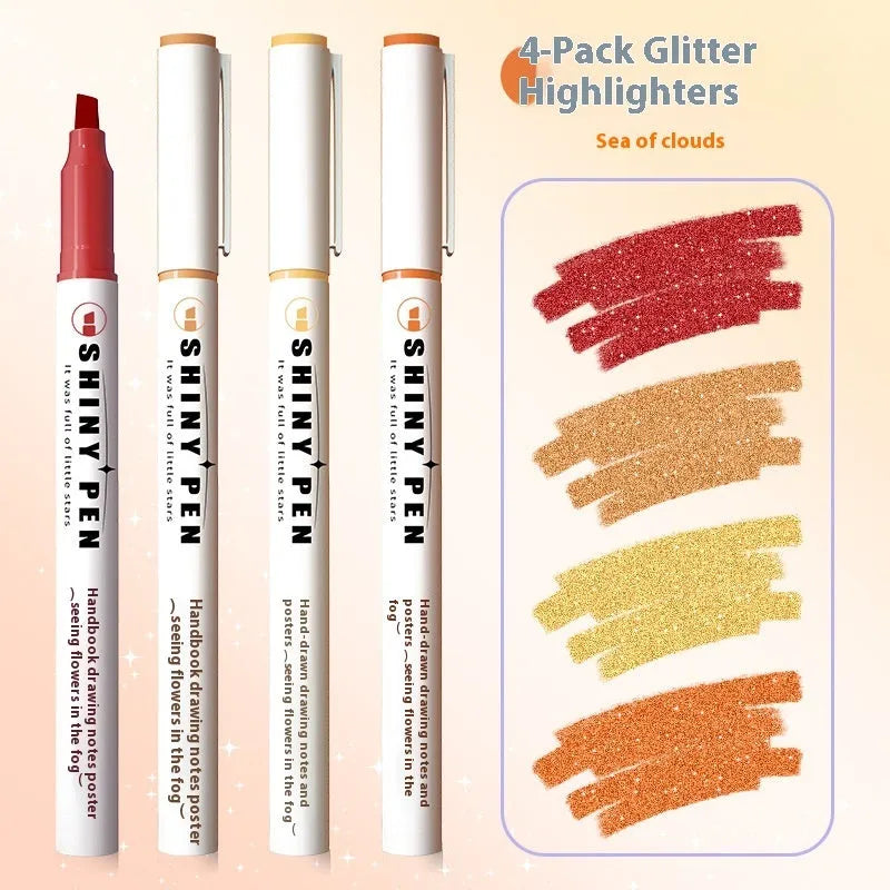 Four glitter highlighter pens with pastel colours and slanted tips on a notebook.