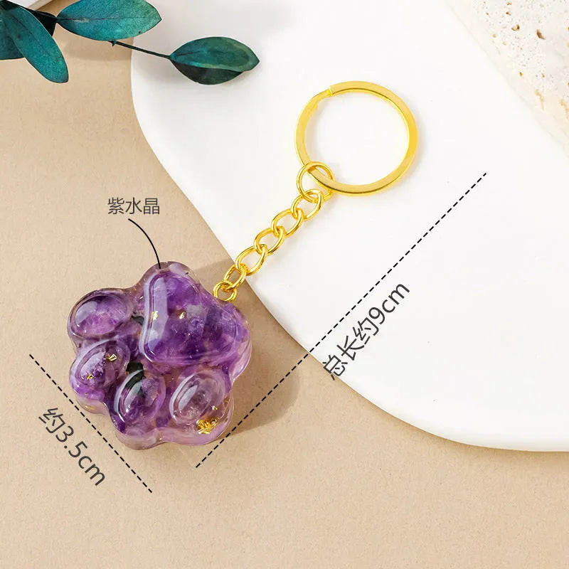 Small natural crystal cat's paw shaped pendant on a metal keyring, available in various crystal colours.