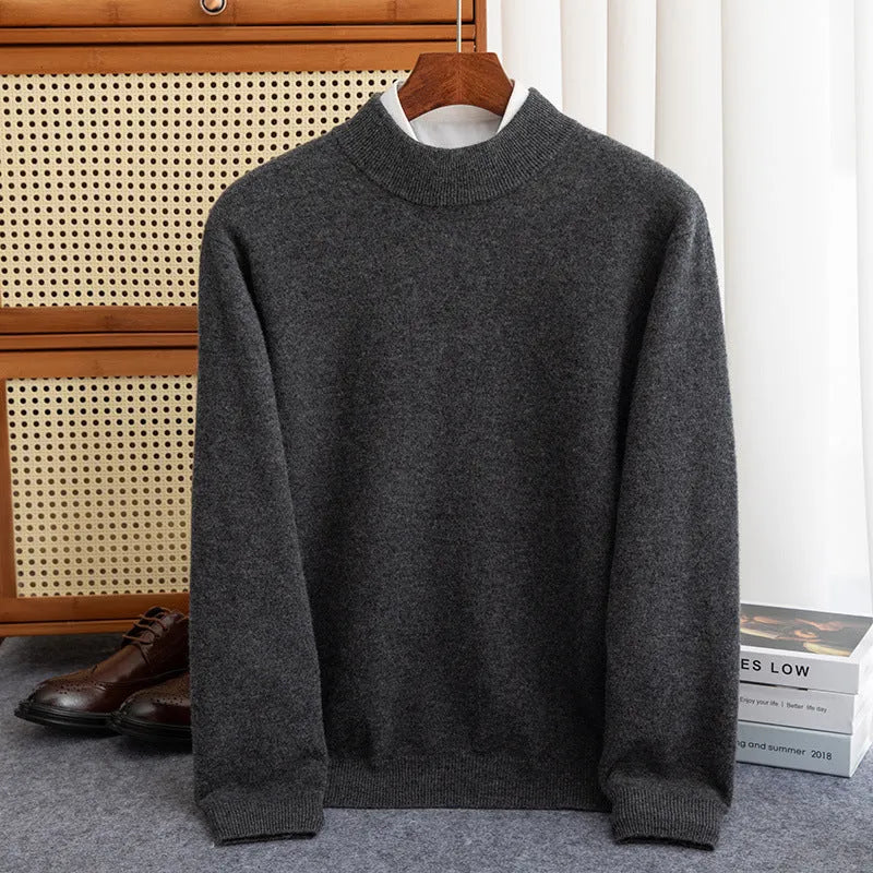 Man wearing a loose-fit half-collar wool sweater in a textured knit, shown in one of the available colours like camel or dark grey.