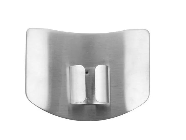 Stainless steel finger guard for protecting fingers when cutting vegetables on a chopping board.