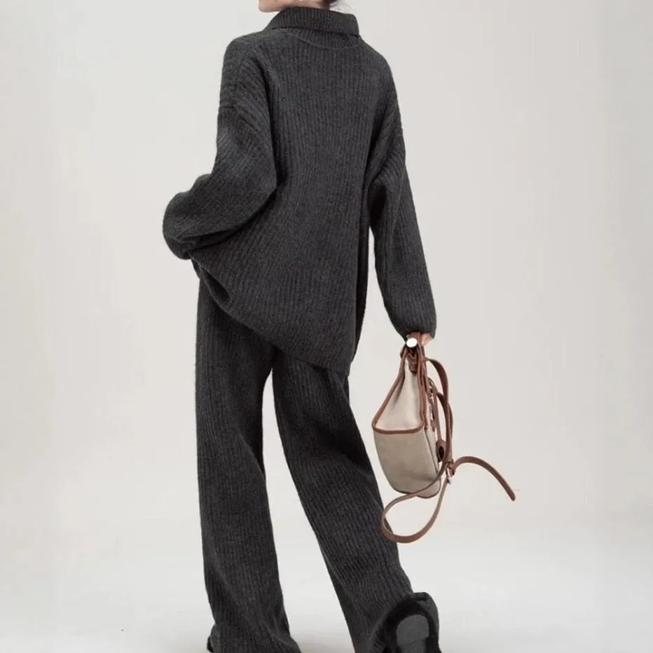 Beige imitation cashmere knitted top and matching trousers two-piece set laid flat.