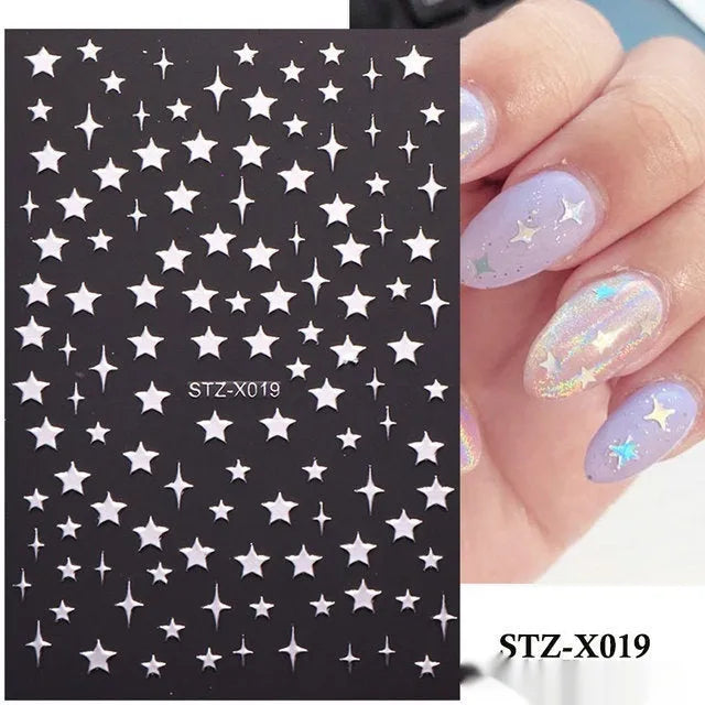 Plastic sheet of black, silver, and cartoon design nail art stickers for DIY manicures.