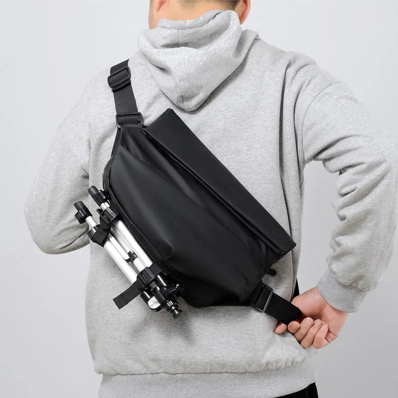 Grey PU crossbody bag showing front zipper compartment and adjustable shoulder strap