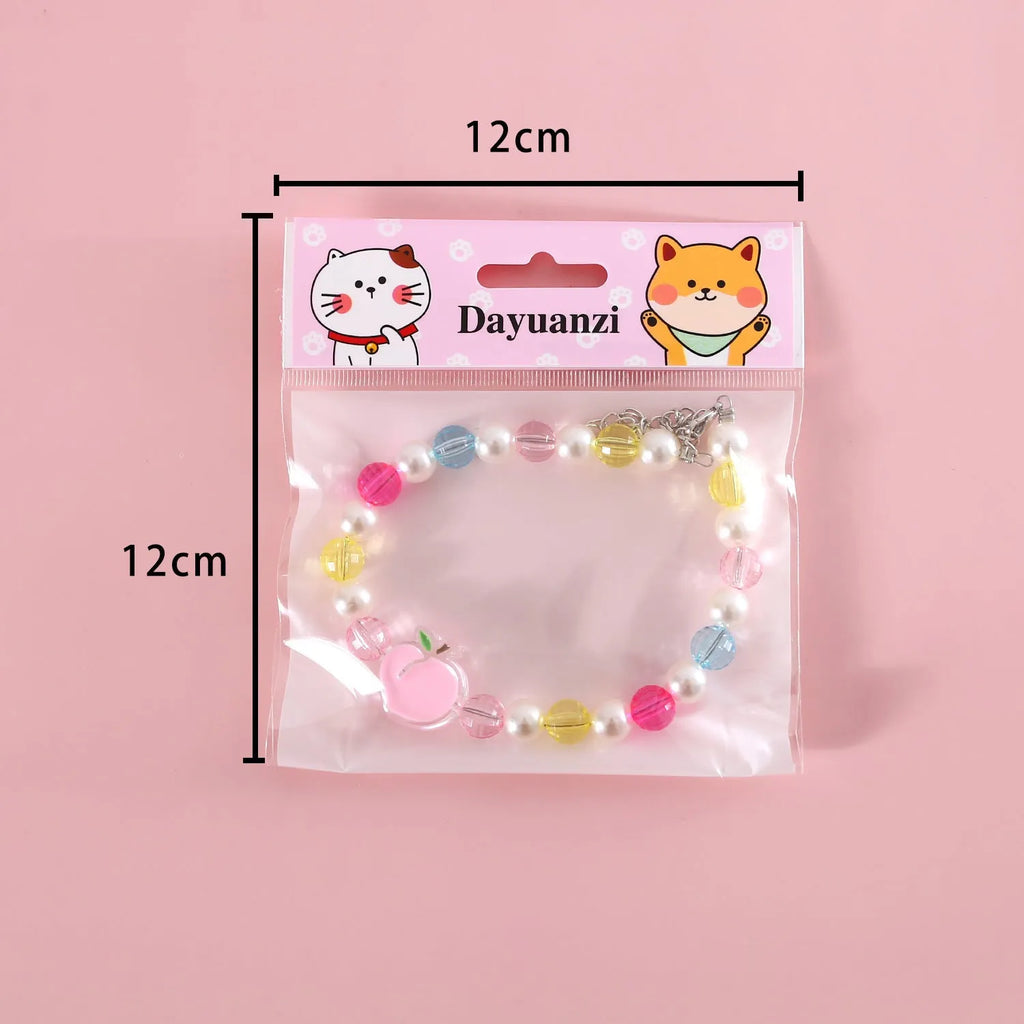 Colourful plastic bead cat necklace adjustable for pet wear in rainbow, peach, or small flower patterns
