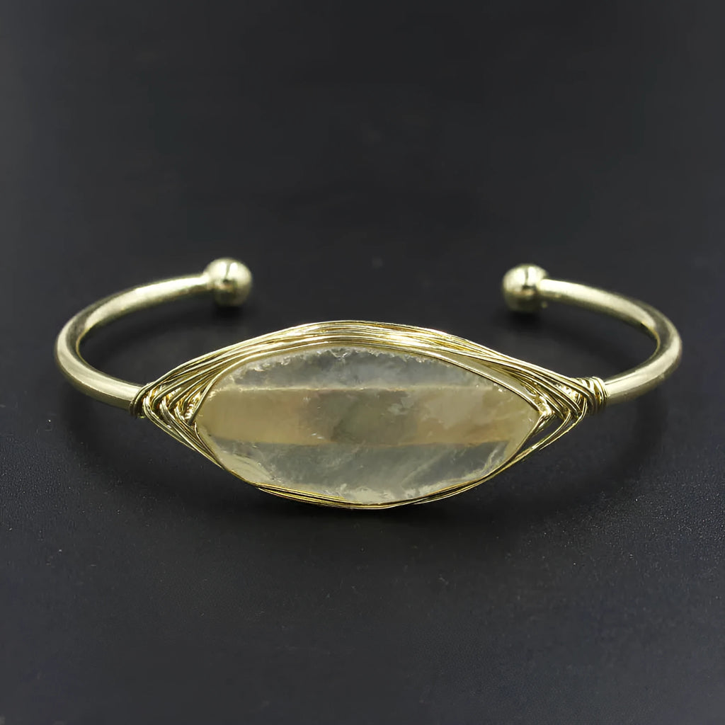 Natural raw gemstone bracelet with winding crystal design showing 8mm stones in various colours