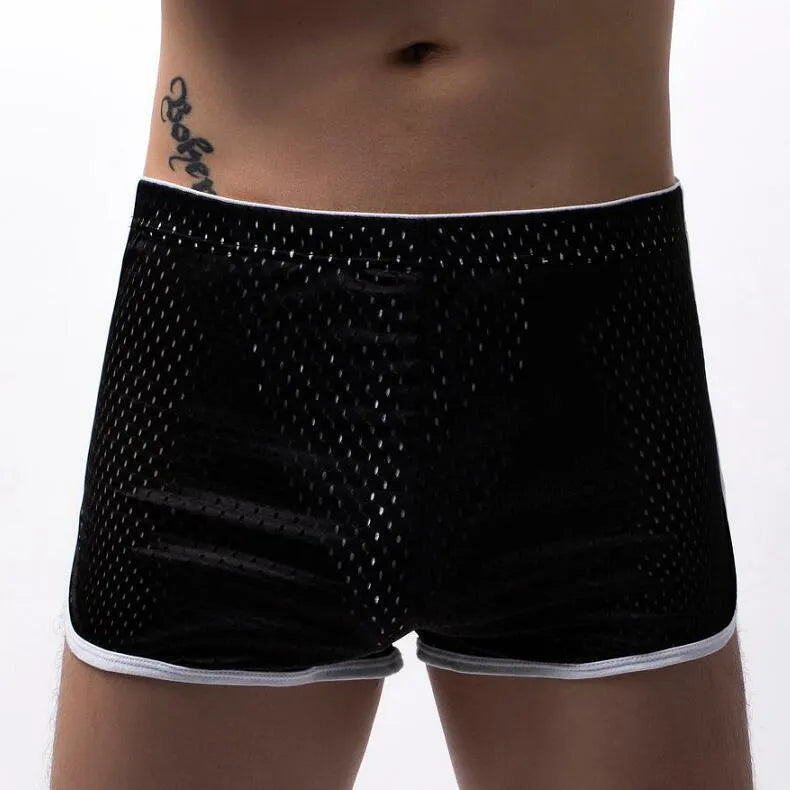 Men's cotton three-point boxer shorts in light blue on a grey background