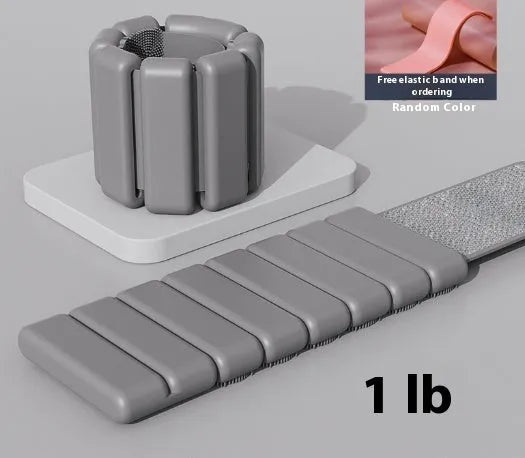 Adjustable silicone fitness bracelet with detachable 1lb or 2lb weight options in pink, black, grey and blue.