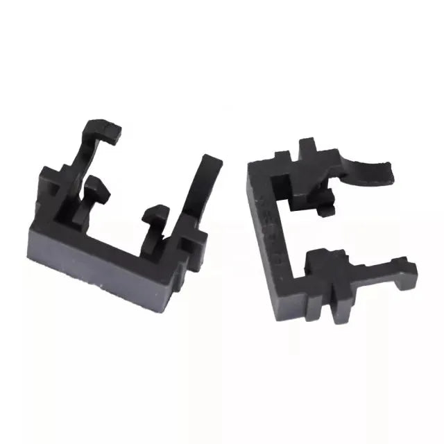 Black plastic LED headlight conversion holder for Ford cars, shown next to scale.