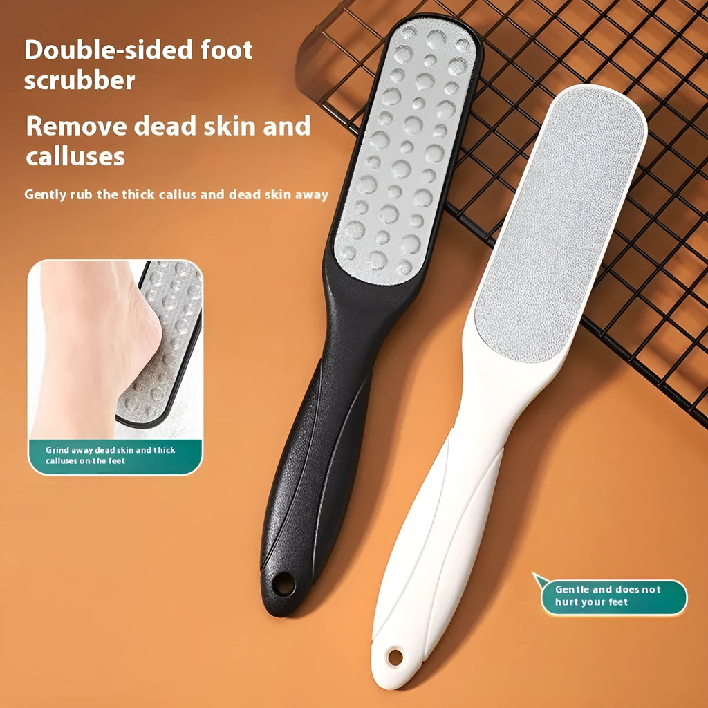 Stainless steel foot grinder tool with white and black double-sided sandpaper files for callus removal.