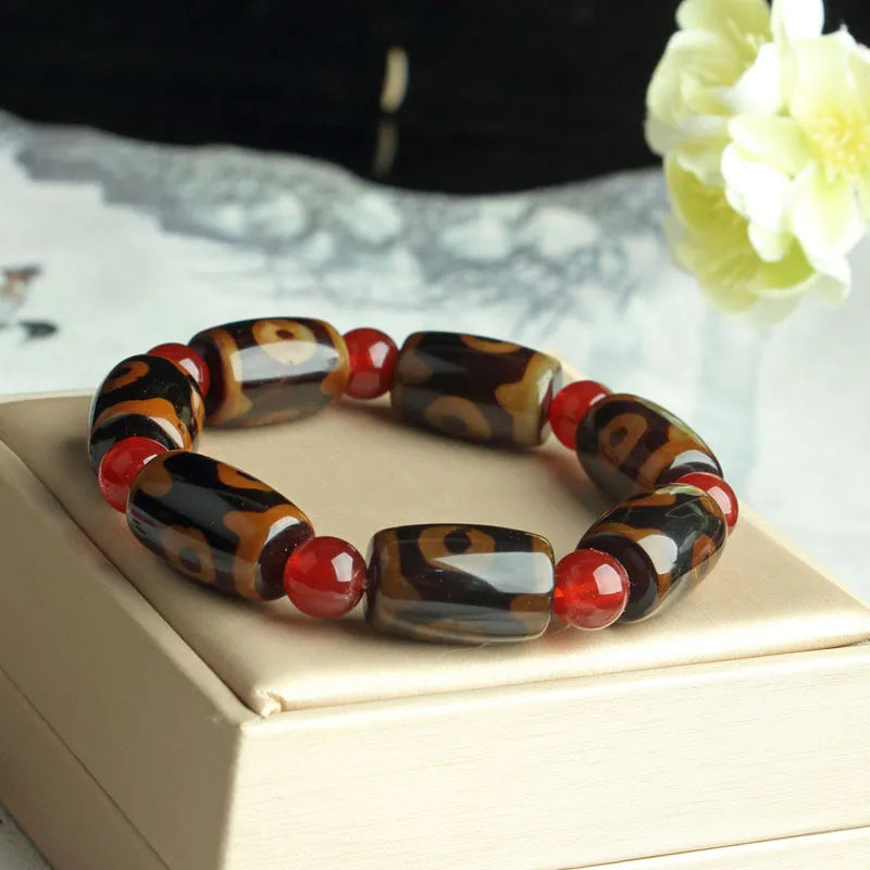 Agate Tibetan dzi bead bracelet with three-eye design and polished finish