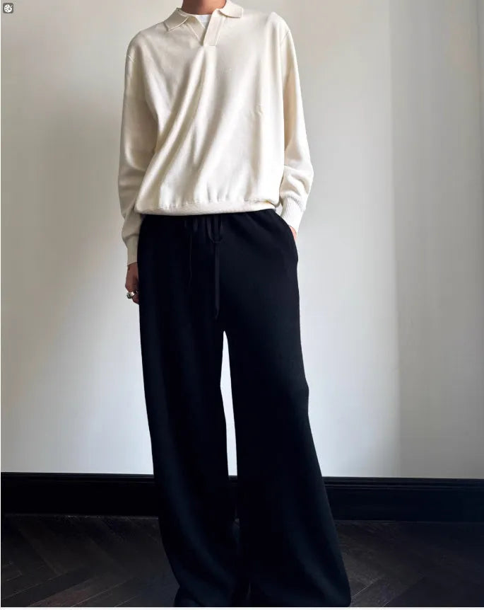 Pure wool polo sweater with lapel collar in loose fit, shown in milky white.